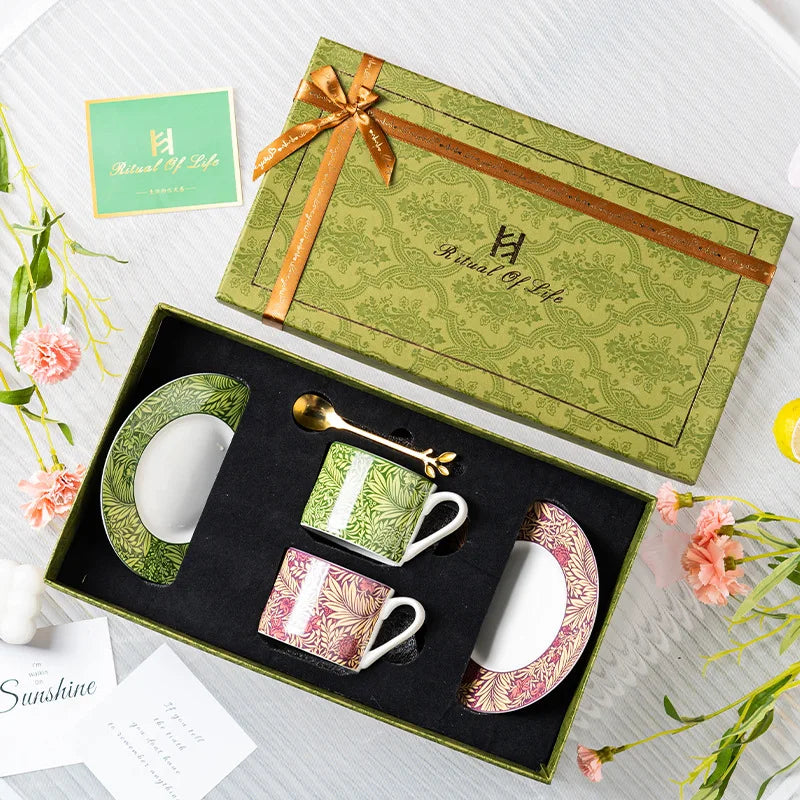 Ceramic coffee set with decorative elements in a 'Royal of Life' branded box.