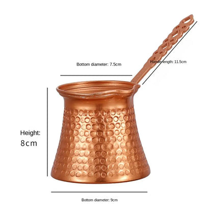 Copper Turkish coffee maker with handle labeled with measurements on white background