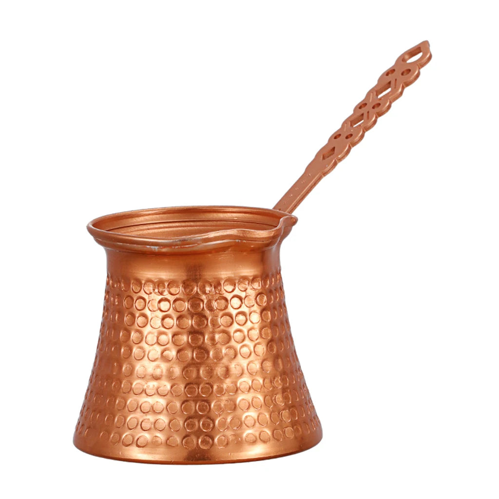 Copper Turkish coffee maker with handle on a white background