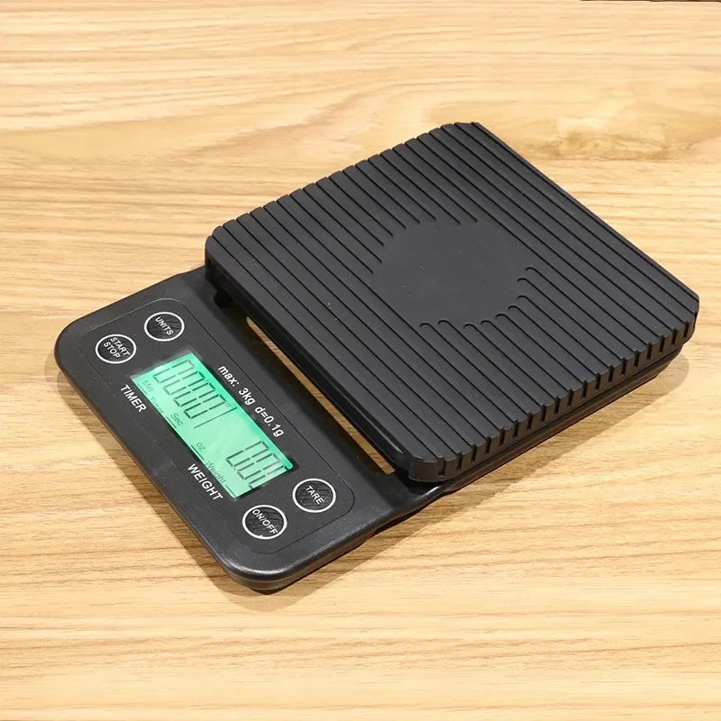 Black digital kitchen scale on a wooden surface