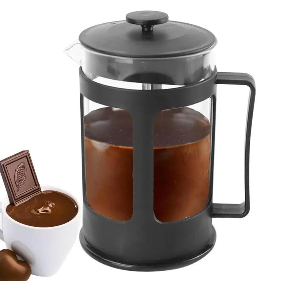 French press with coffee and a small cup of coffee on a white background