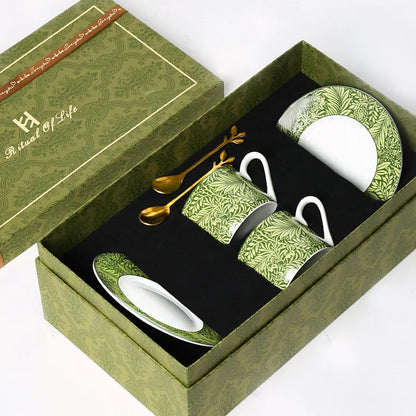 Green ceramic coffee set with matching teacup, saucer, and spoon in a 'Ritual of Life' box.